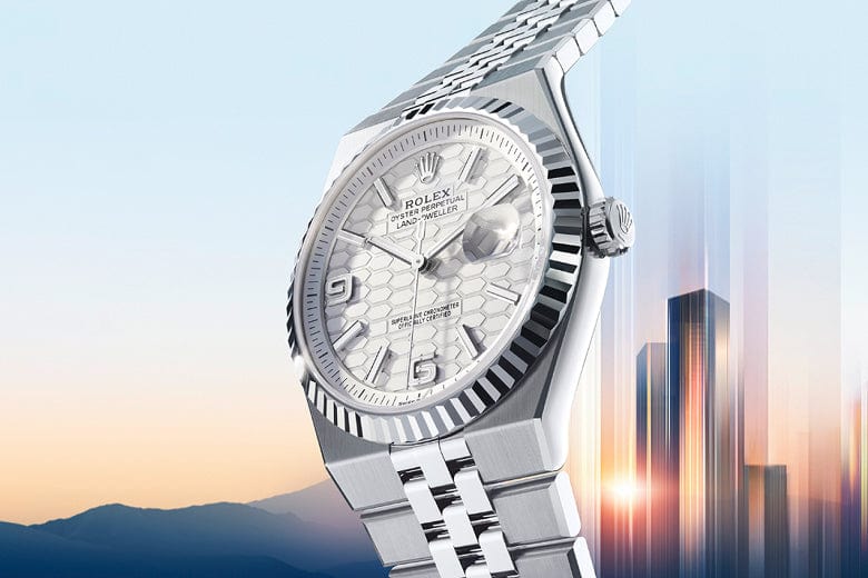 A Rolex wristwatch with a light blue face, silver casing, and a brown leather strap is displayed against a gradient blue background.